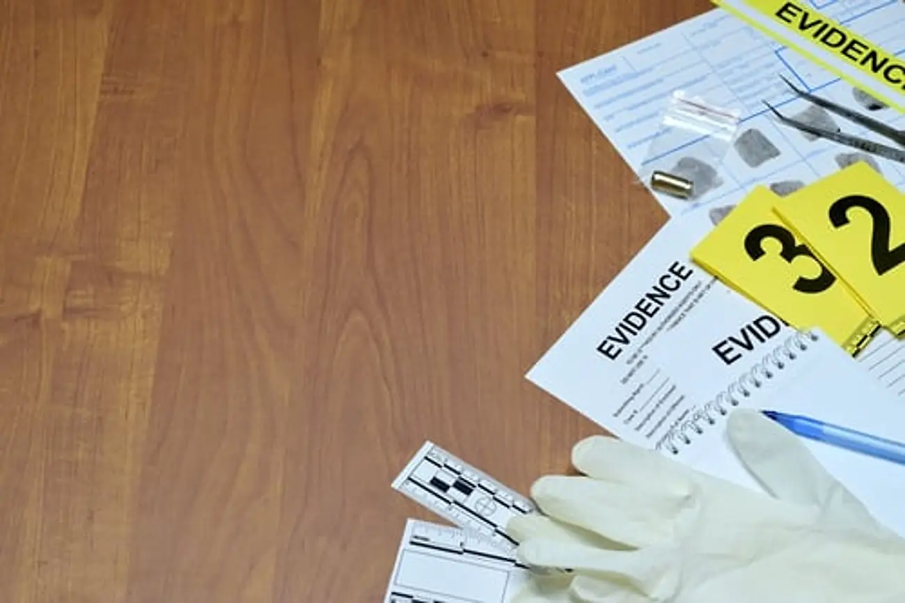 Evidence markers and gloves at a released crime scene before remediation